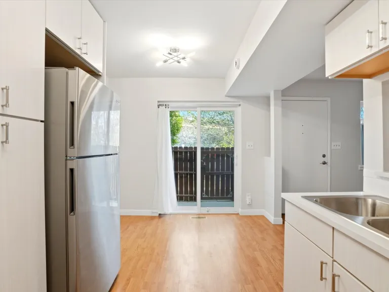 22-3315 Talisman Ct C-kitchen to dining sliding door to porch