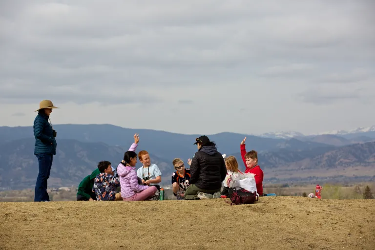 children on field trip in open space with OSMP rangers