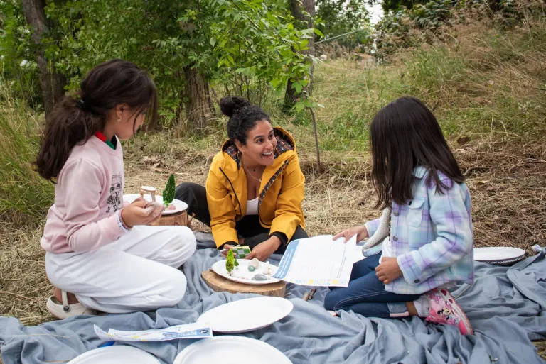 children making art in park