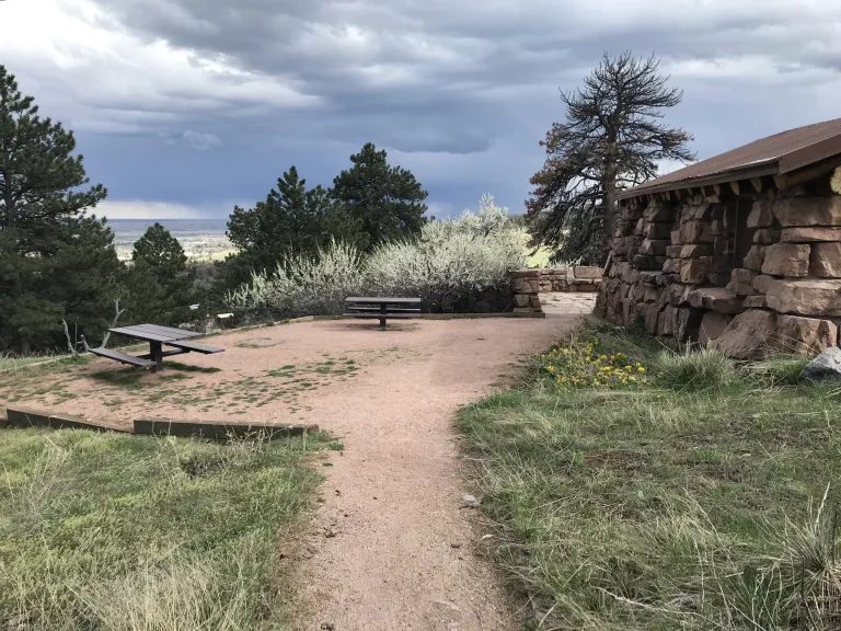A gravel trail leads to the outdoor picnic area on the east side of the Halfway House