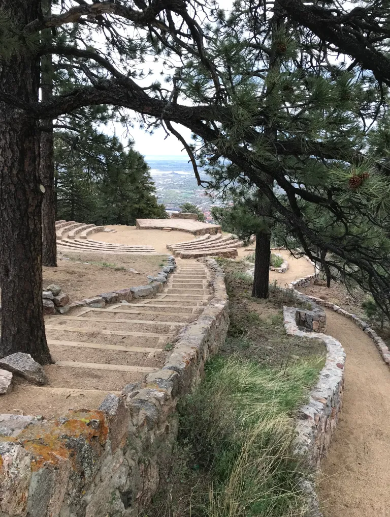 Stone steps on the left and a ramp on the right lead down to the Sunrise Amphitheater.