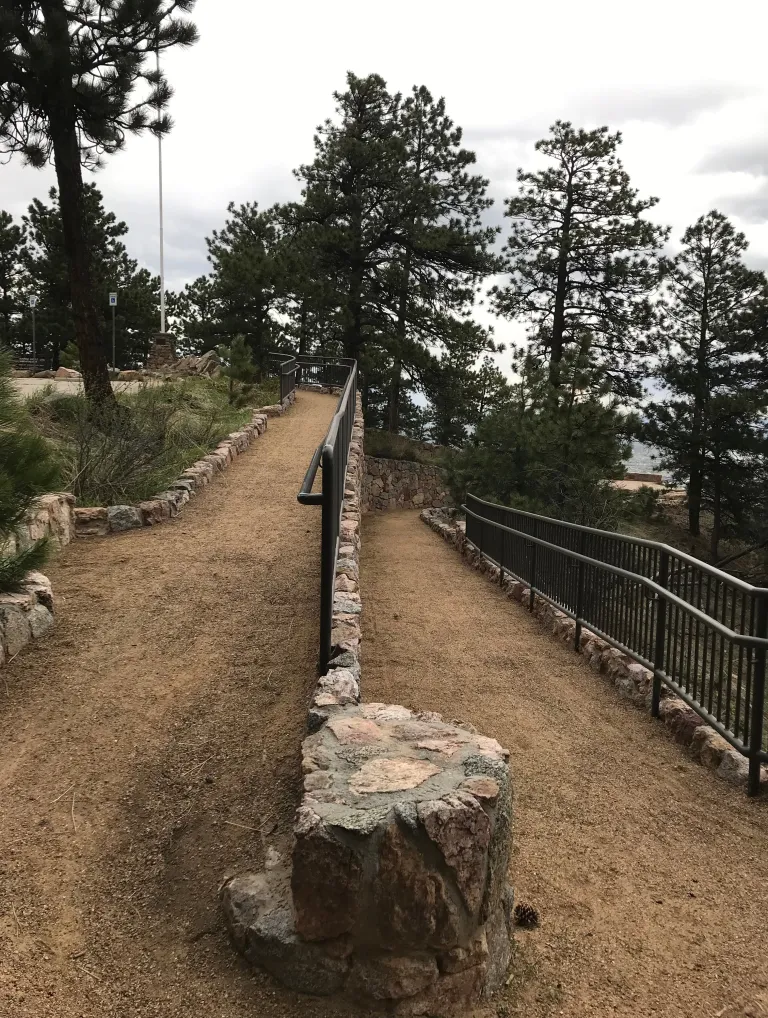 Viewed from the turn, a dirt ramp heads up to the left and down to the right.