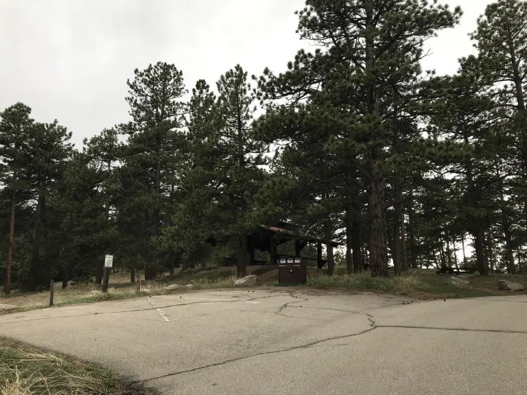 A few parking spaces with the Wood Shelter in the background