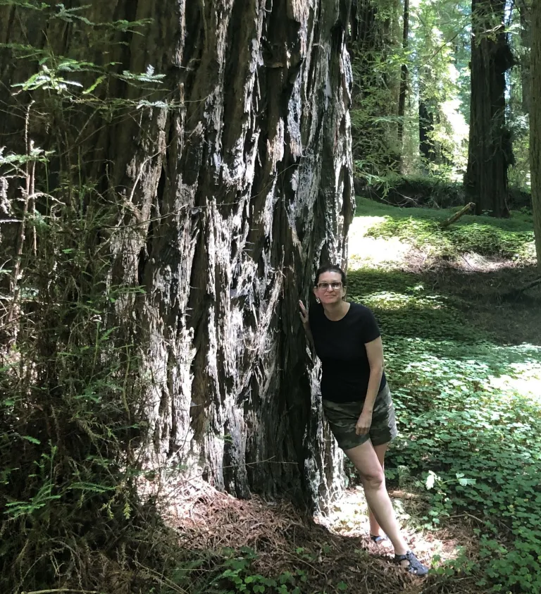 Kathleen Alexander and a redwood tree