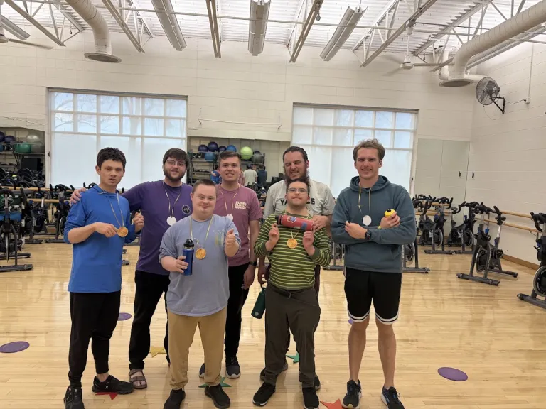 EXEXPAND participants show off their medals after the spinning Olympics