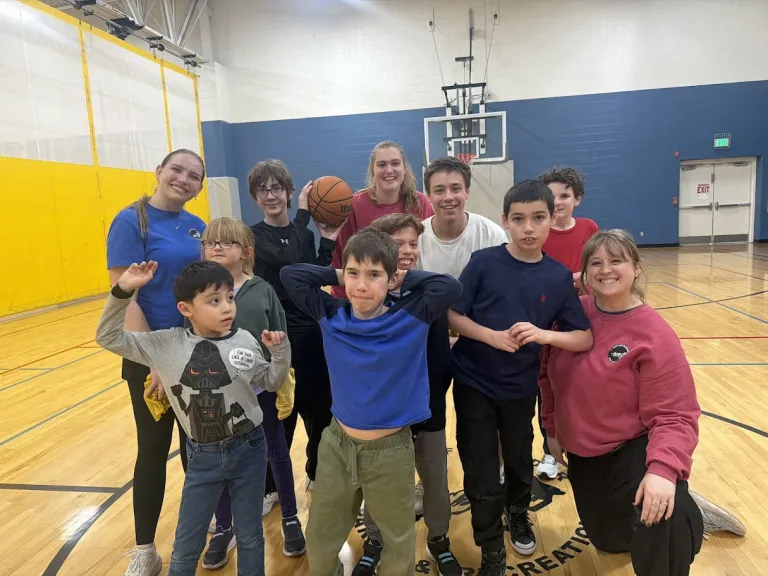 EXPAND Youth pose for a photo after basketball practice