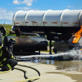 Firefighters extinguishing fire during training
