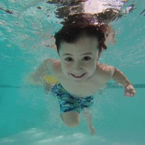 Kid swimming under water