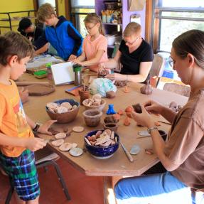 Kids taking a pottery class at the Pottery Lab