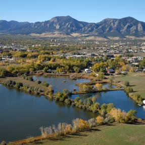 View of Boulder Flatirons in the background and the city of Boulder in the foreground