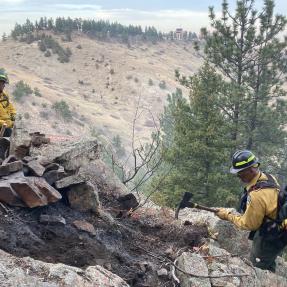 Firefighters working on OSMP land near NOAA