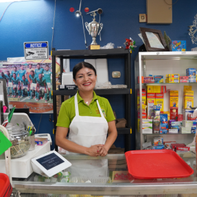 Ana Nieto poses in front of her business, Panaderia Sabor a Mexico