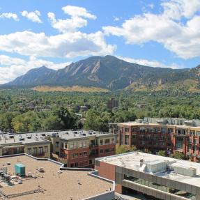 View of Boulder Flatirons from a rooftop in downtown Boulder