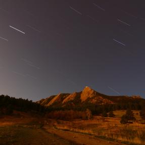 Boulder flatirons at night with a starry sky
