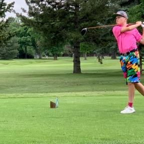 Golfer in colorful clothing at the Optimist Tournament