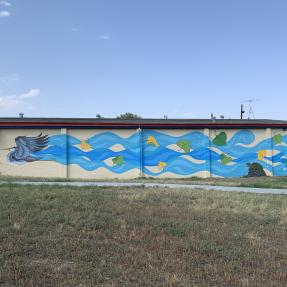 Mural visualizing the wind coming off a bird's wings when flying