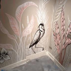 Multi-wall mural of a heron and plants 