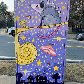 Electrical box with a cartoon scene of moths and mice