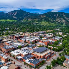 Aerial view of Boulder overlooking downtown area and the Flatirons