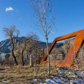Sculpture in perspective of the library behind