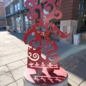 Close up photo of the sculpture and the placard 