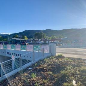 Photo of Broadway Ave. overpass with Sharon Dowell's art on the bridge railings