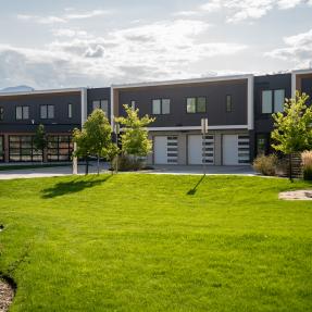 3261 Airport Rd Unit D-105 Building view a far and lawn view outside