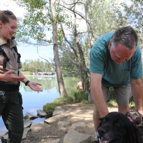 Boulder Parks and Recreation Ranger helping community member