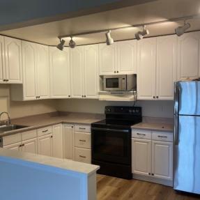 3150 Iris Ave #F211 - kitchen with new appliances painted cabinets new flooring