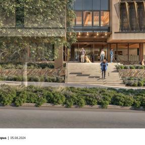 outside of large building with lots of windows and wide stairway to entrance doors.