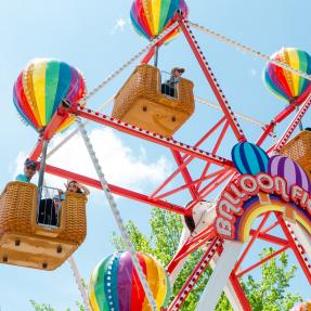 Colorful ferris wheel with riders