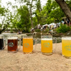 Mugs of beer lined up on the Boulder Creek