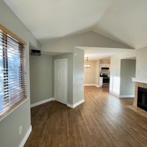 5540 Stonewall Pl 16 - Interior living room fireplace dining room kitchen view