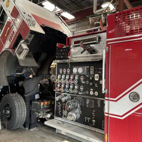 A City of Boulder fire engine undergoing maintenance or repairs in the fleet garage.