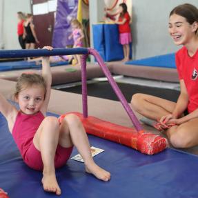 Kid having fun during gymnastics class at North Boulder Recreation Center