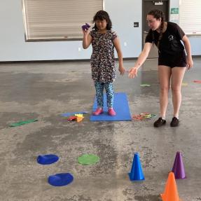 Amico campers playing a game indoors