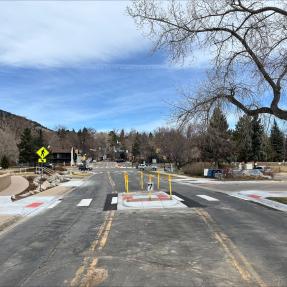 6th Street South of Boulder Canyon Drive after pedestrian crossing treatment with crosswalk and median and signage