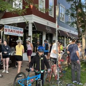 Community members and their bikes at a Bike to Work Day station
