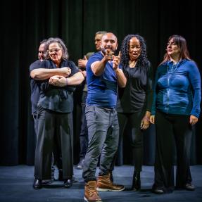 Playback theater troupe performing onstage