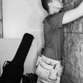 Andy working on a music studio. 
