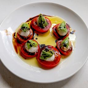 Caprese salad on a white plate. 