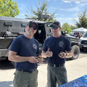 two firefighters smiling 
