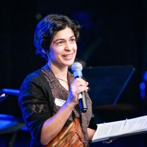 Motus employee on stage during the Elevate Boulder monologue performance at Motus Theater.