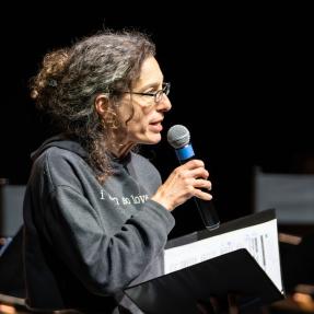 Motus Theater employee on stage during the Elevate Boulder monologue performance at Motus Theater.
