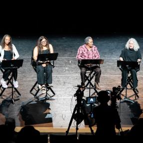 Elevate Boulder participants on stage during their monologue performance at Motus Theater.