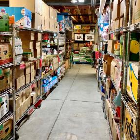 Stocked food bank shelves