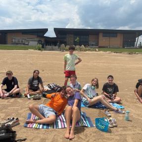 Camp Amico campers hang out on the Boulder reservoir beach.