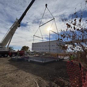 First section of modular home being placed on the foundation. 