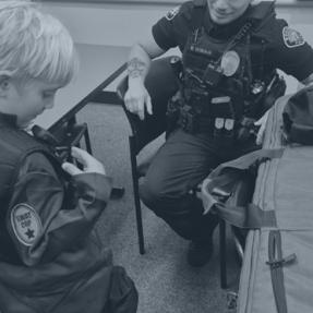 BPD Officer with kid in PD costume