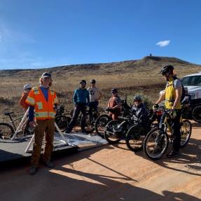 An adaptive mountain bike program with participants on mountain bikes and hand-cycles.